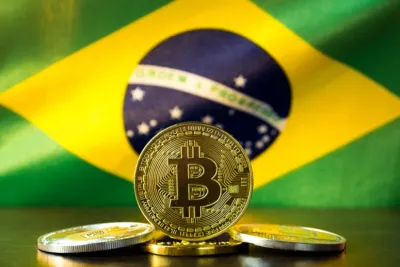Moeda de bitcon com bandeira do Brasil ao fundo
